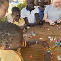making and teaching the kids how to make hand bands