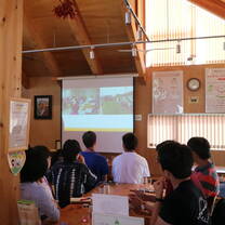 Participants at Riku Cafe learning about how the cafe was established