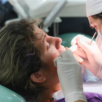 A Projects Abroad Dentistry Partner works with a Patient in Córdoba, Argentina