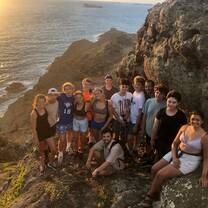Group of teens on island at sunrise