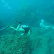 Two teen scuba divers underwater