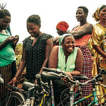 Through our partners and collaborators, we donate bicycles to attend different needs of our community, such as students that live very far away from school, people from remote areas who need transportation to hospitals or men and women that are out of work due to lack of transportation. The photo shows a group of women who received bicycles from the One Bike donation mobility project, after Tour de Kili