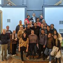 Students and instructors pose for a graduation photo.