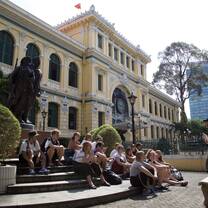 Class time on the steps of the Ho Chi Minh Central Post Office