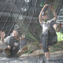 Volunteers add glass bottle skylights