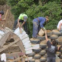 Volunteers Build With Green Materials