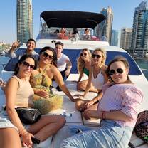 students from Speak English Institute in Dubai on a yacht for a social activity 