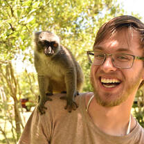 A student with a monkey on his shoulder