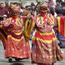 traditional figures dancing in the town square