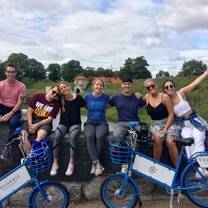 Student participants biking in Copenhagen in the summer