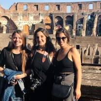 Girls posing in front of Colosseum in Rome