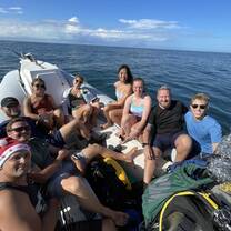 a group poses on a boat 