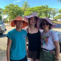 a poses for a photo in fun hats 