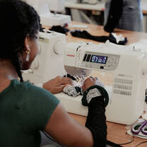 Student using sewing machine