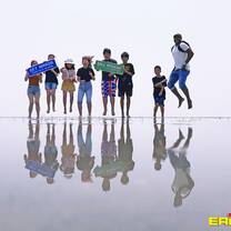 students standing near water