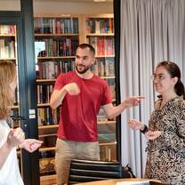 students having a discussion in a library