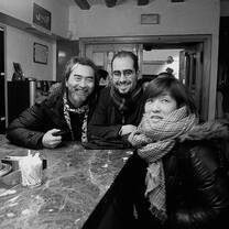 three students at a wine bar