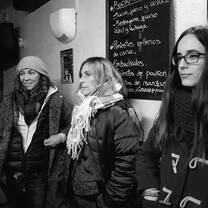 three women at a wine bar