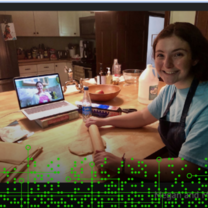 Image of a student with a rolling pin. A laptop in the background shows another student's face. 