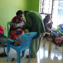 Our Trainer instructing women how to make beaded products
