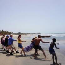 Helping fisherman pull in a net
