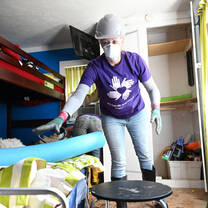 Volunteer working to clear a home