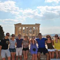 Many students smiling in front of the Parthenon