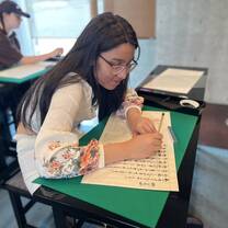 girl writing in japanese