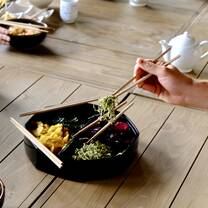 chopsticks picking up some food