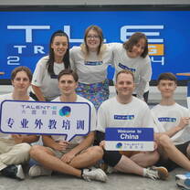 Group photo holding Talent-E signs