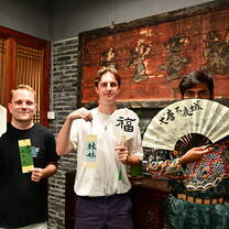 Group of men holding Chinese signs