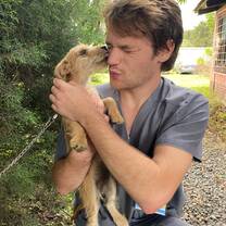 Student with puppy