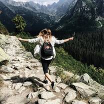 A girl walking through the moutains