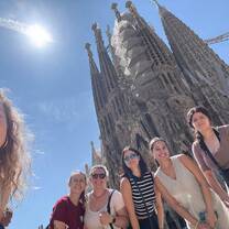 Girls standing in front of the Sagrada Familia