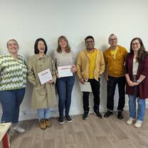 Students and teachers celebrating during the certificate distribution ceremony at the end of the course.