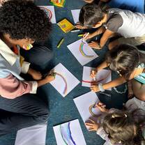 Students drawing rainbows