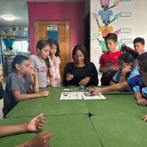 Students in activity with their teacher