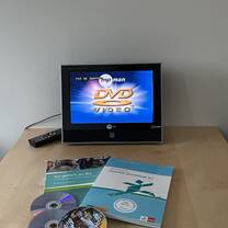 A DVD/CD player with books and CDs 