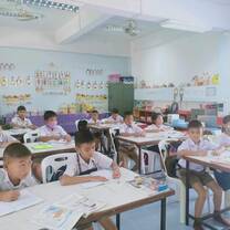 Kids writing in the classroom