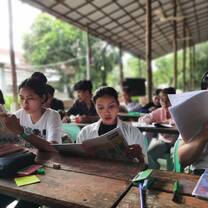 Students reading a booklet