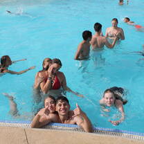 Students relaxing and having fun at the school’s swimming pool.