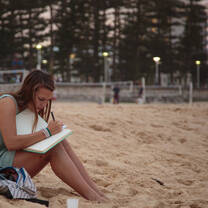Student Studying on the Beach in Noosa Australia