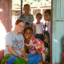 Rylie at a Fijian village -Photo copyright Rylie Genseal