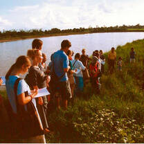 students in a rice paddy field in Thailand