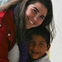 Volunteer with smiling child in Guatemala