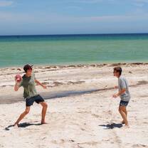 Student participants playing football on the beach in Merida