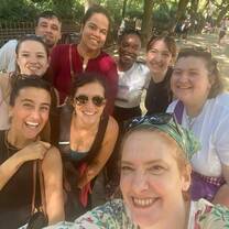 A group of students smiling in the street