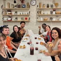 A group smiling and drinking sangria