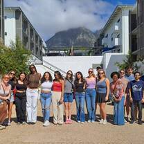 Group of intern abroad students posing in front of housing in Cape Town