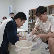 Gap year students making pottery in Shanghai classroom